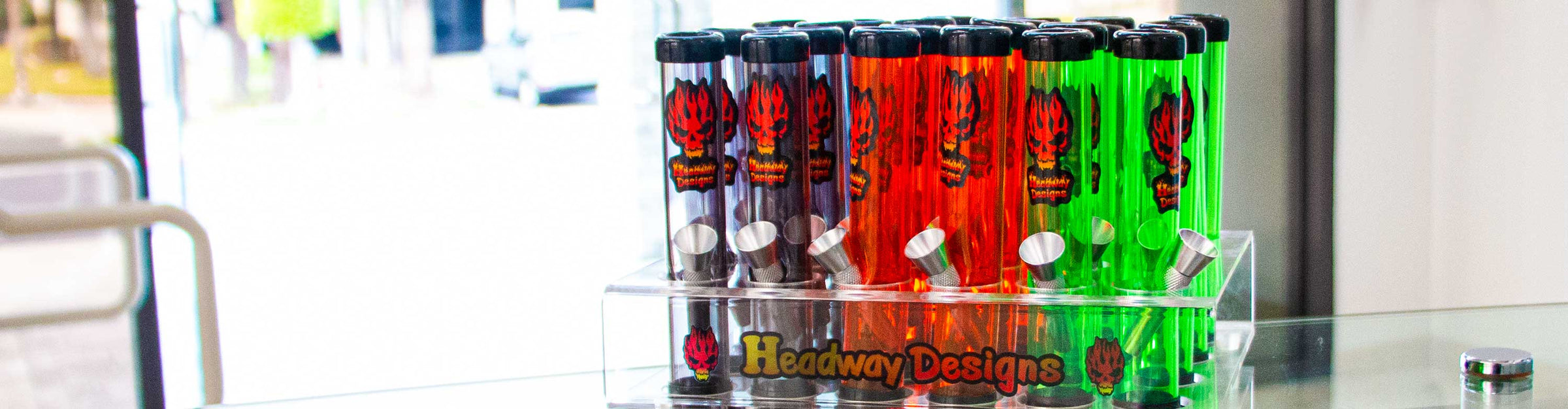 Headway Designs water pipes standing on office desk near front entrance of buildng.