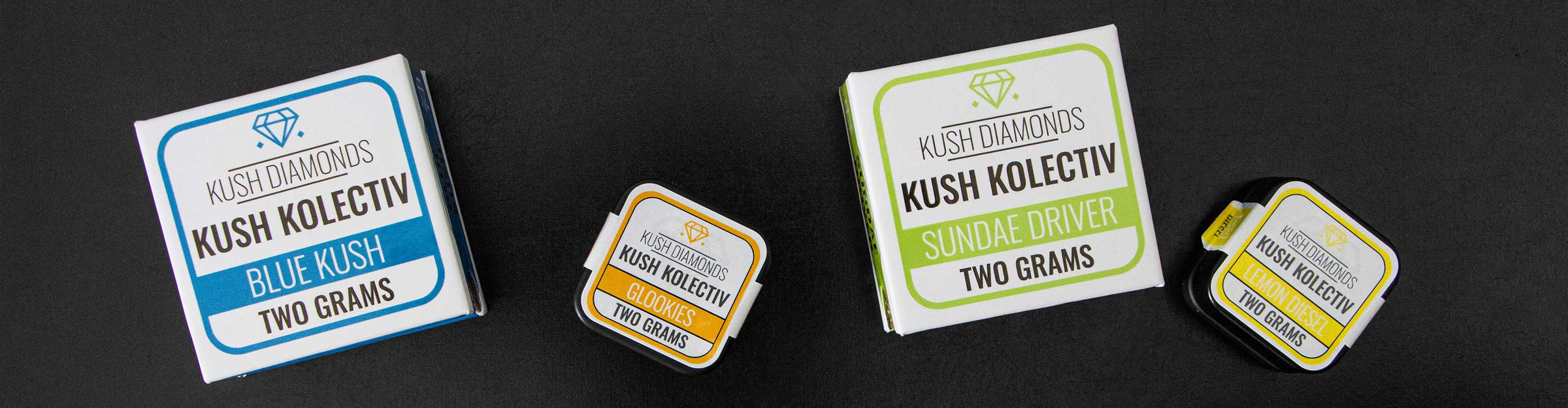 Kush Kolectiv Concentrates laying down on black wooden table